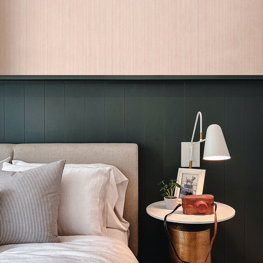 Faux Grasscloth Removable Wallpaper - A bed and nightstand in a bedroom featuring Faux Grasscloth Peel And Stick Wallpaper in textured blush | Tempaper#color_textured-blush