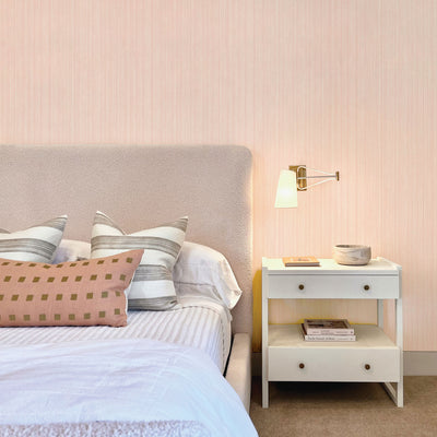 Faux Grasscloth Removable Wallpaper - A bedroom with a pink bed and white nightstand featuring Faux Grasscloth Peel And Stick Wallpaper in textured blush | Tempaper#color_textured-blush