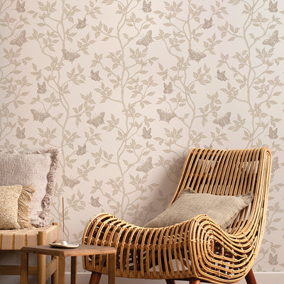 Monarch Non-Pasted Wallpaper - A tan chair in front of Monarch Unpasted Wallpaper in fawn | Tempaper#color_fawn