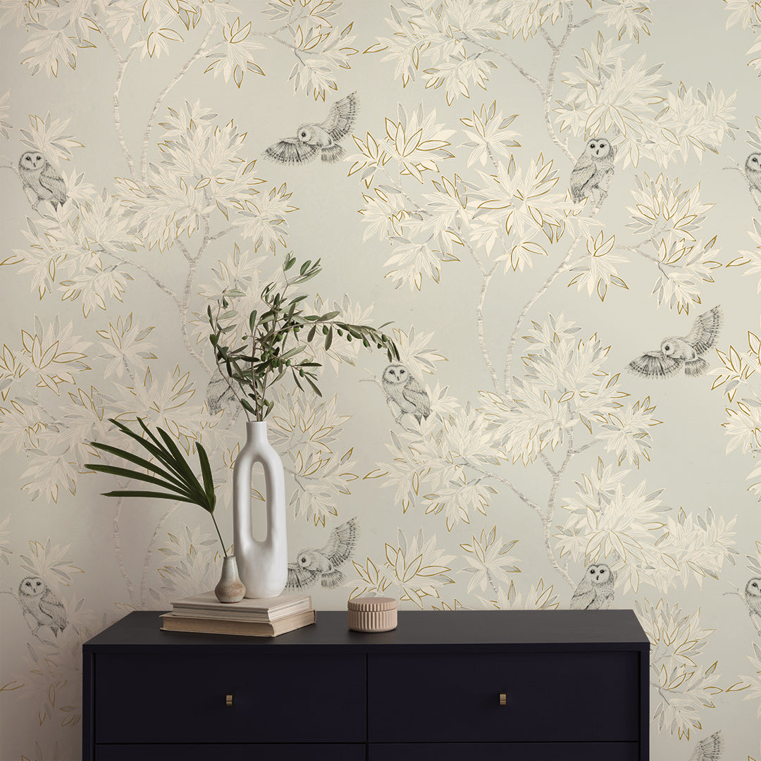 Parliament Non-Pasted Wallpaper - A black dresser and plants with Parliament Unpasted Wallpaper in natural beige | Tempaper#color_natural-beige