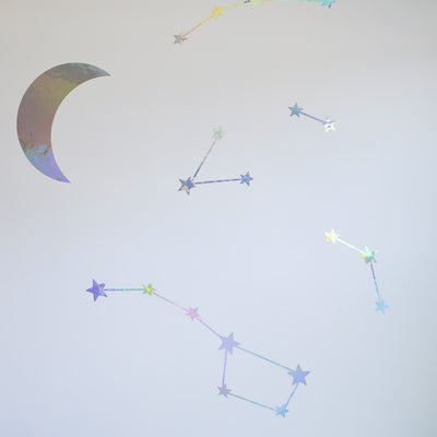 More constellation formations on a wall from Tempaper's Moons & Constellations wall decal set.