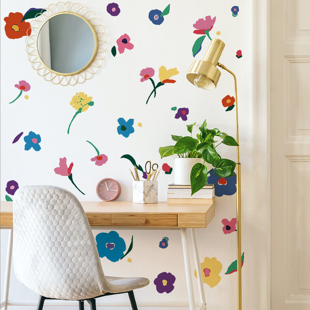 Abstract Flower wall decals are displayed on a white wall in a home office.