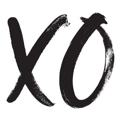 A sample of the XOXO wall decals from Tempaper with the letter X and O written in black script.