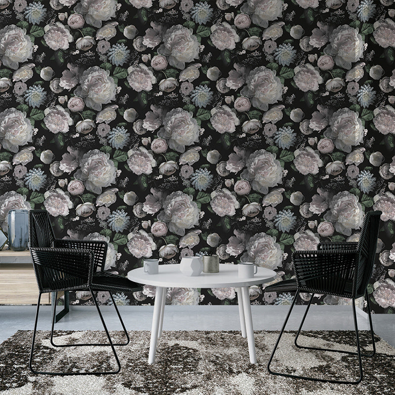 A small dining area with Moody floral peel-and-stick wallpaper from Tempaper on the wall behind.