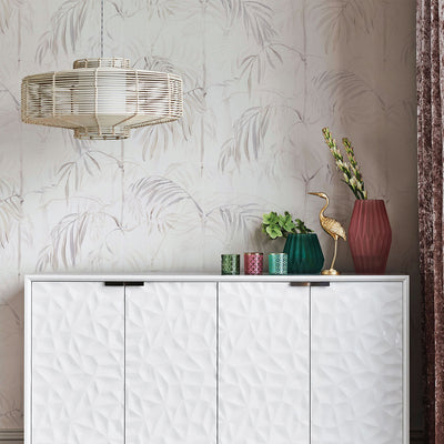 Bamboo Gardens Non-Pasted Wallpaper - A white dresser with plants and candles on top in front of Bamboo Gardens Unpasted Wallpaper in fog | Tempaper#color_fog