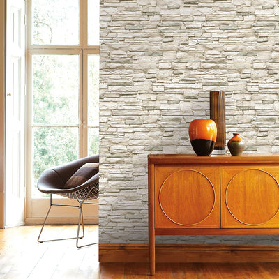 Light Stone Removable Wallpaper - A wood dresser with three vases on top in front of a wall featuring Tempaper's Light Stone Peel And Stick Wallpaper | Tempaper