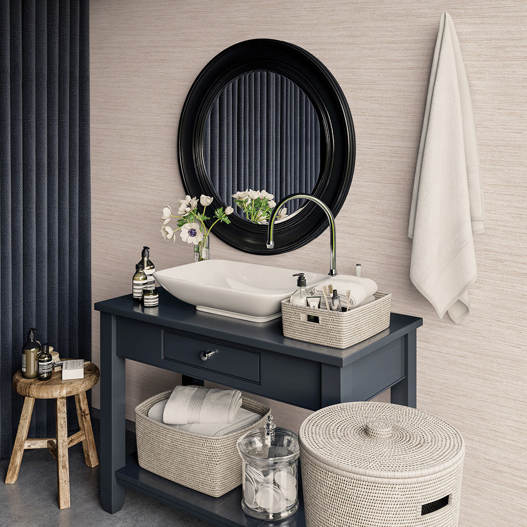 Faux Horizontal Grasscloth Removable Wallpaper - A bathroom with a dark gray vanity and white sink underneath a black mirror, featuring Faux Horizontal Grasscloth Peel And Stick Wallpaper in textured ecru | Tempaper#color_textured-ecru