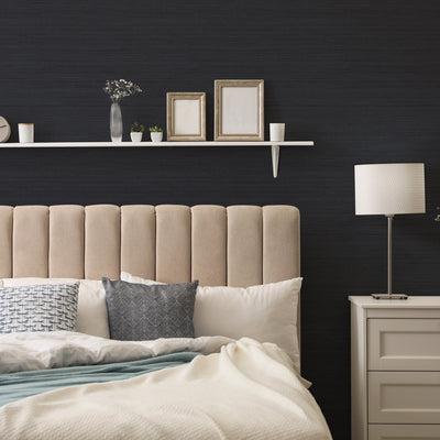 Faux Horizontal Grasscloth Removable Wallpaper - A bedroom with a bed and white nightstand featuring Faux Horizontal Grasscloth Peel And Stick Wallpaper in textured navy | Tempaper#color_textured-navy