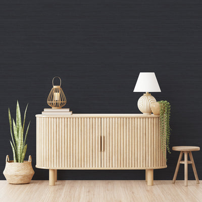 Faux Horizontal Grasscloth Removable Wallpaper - A wood dresser in a room featuring Faux Horizontal Grasscloth Peel And Stick Wallpaper in textured navy | Tempaper#color_textured-navy