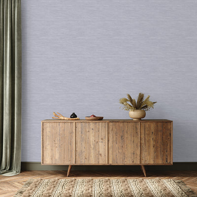 Faux Horizontal Grasscloth Removable Wallpaper - A wood sideboard and a rug in a room featuring Faux Horizontal Grasscloth Peel And Stick Wallpaper in textured powder blue | Tempaper#color_textured-powder-blue