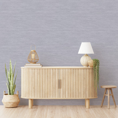 Faux Horizontal Grasscloth Removable Wallpaper - A wood dresser in a room featuring Faux Horizontal Grasscloth Peel And Stick Wallpaper in textured powder blue | Tempaper#color_textured-powder-blue