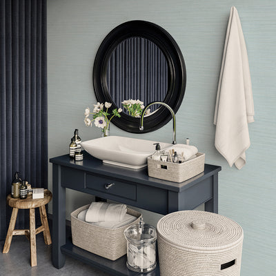 Faux Horizontal Grasscloth Removable Wallpaper - A bathroom with a dark gray vanity and white sink underneath a black mirror, featuring Faux Horizontal Grasscloth Peel And Stick Wallpaper in textured seaglass | Tempaper#color_textured-seaglass