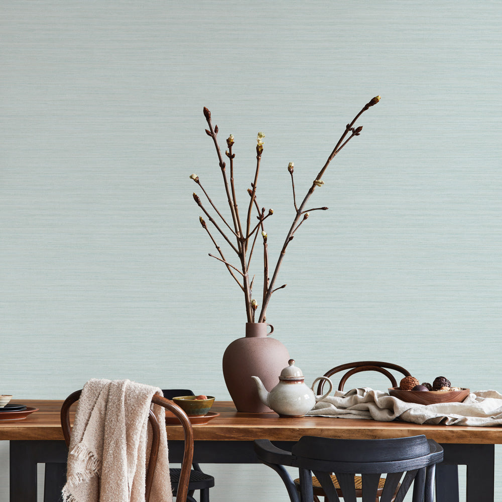 Faux Horizontal Grasscloth Removable Wallpaper - A dining room with a wood table and chairs featuring Faux Horizontal Grasscloth Peel And Stick Wallpaper in textured seaglass | Tempaper#color_textured-seaglass