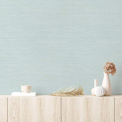 Faux Horizontal Grasscloth Removable Wallpaper - A wood dresser with beige vases and a wall featuring Faux Horizontal Grasscloth Peel And Stick Wallpaper in textured seaglass | Tempaper#color_textured-seaglass