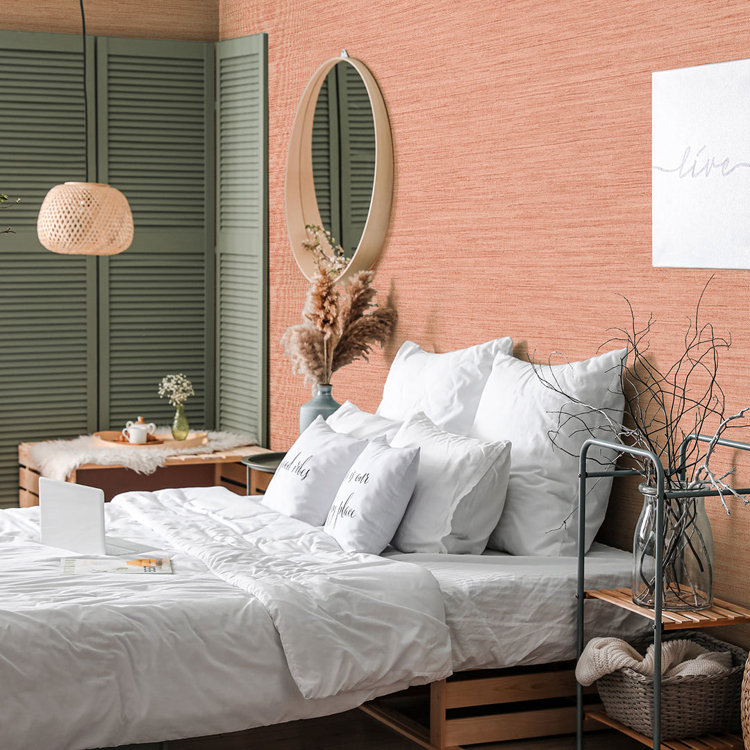 Faux Horizontal Grasscloth Removable Wallpaper - A bedroom with a bed and wood furniture featuring Faux Horizontal Grasscloth Peel And Stick Wallpaper in textured salmon | Tempaper#color_textured-salmon
