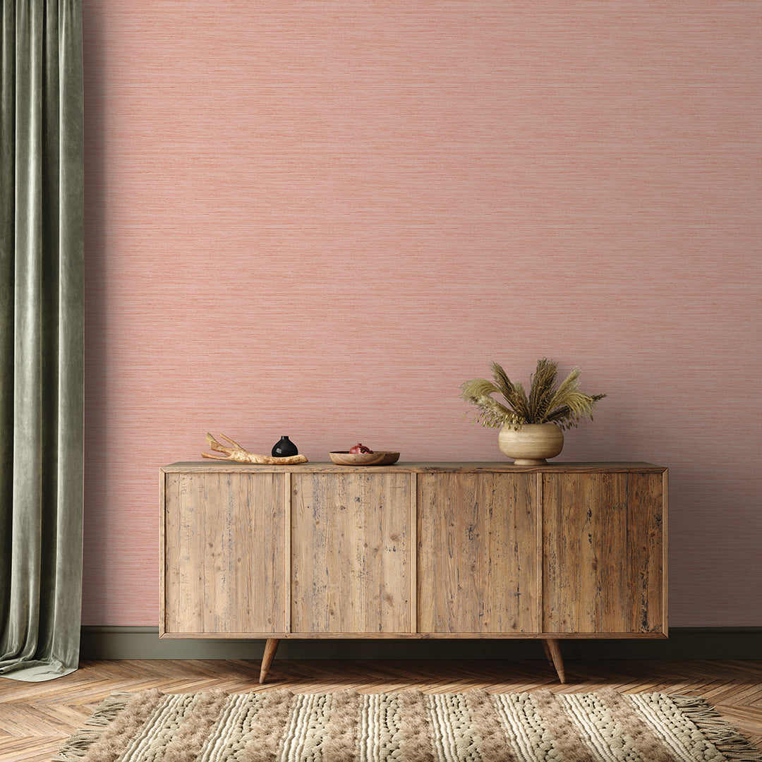 Faux Horizontal Grasscloth Removable Wallpaper - A wood sideboard and a rug in a room featuring Faux Horizontal Grasscloth Peel And Stick Wallpaper in textured salmon | Tempaper#color_textured-salmon