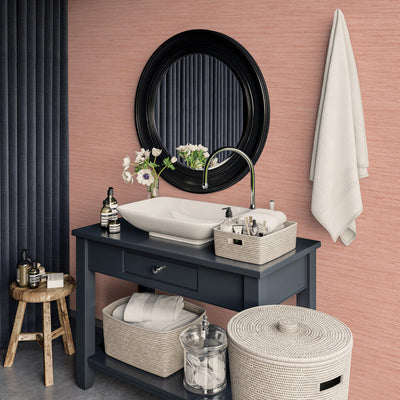 Faux Horizontal Grasscloth Removable Wallpaper - A bathroom with a dark gray vanity and white sink underneath a black mirror, featuring Faux Horizontal Grasscloth Peel And Stick Wallpaper in textured salmon | Tempaper#color_textured-salmon