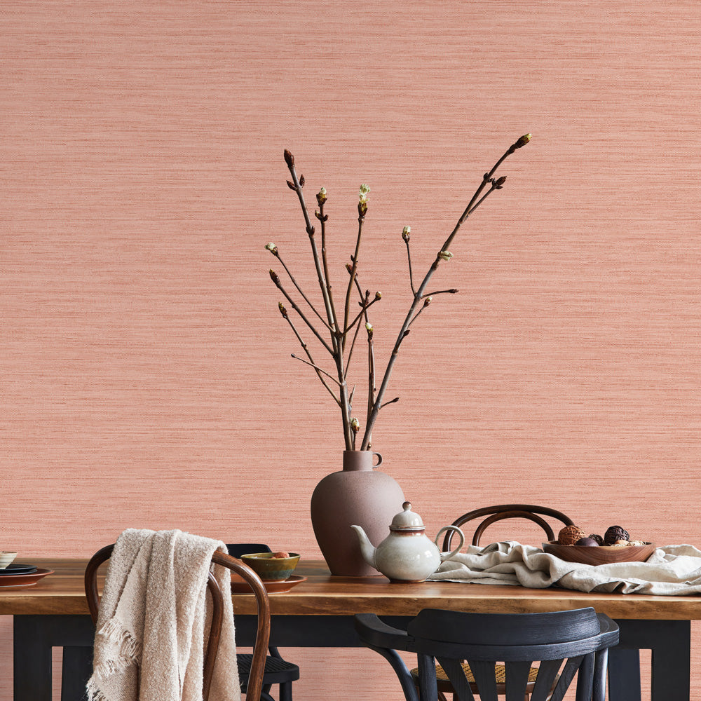 Faux Horizontal Grasscloth Removable Wallpaper - A dining room with a wood table and chairs featuring Faux Horizontal Grasscloth Peel And Stick Wallpaper in textured salmon | Tempaper#color_textured-salmon