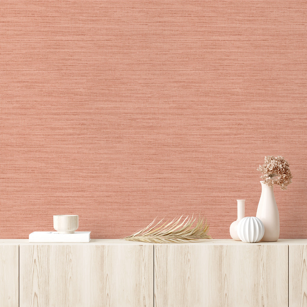 Faux Horizontal Grasscloth Removable Wallpaper - A wood dresser with beige vases and a wall featuring Faux Horizontal Grasscloth Peel And Stick Wallpaper in textured salmon | Tempaper#color_textured-salmon