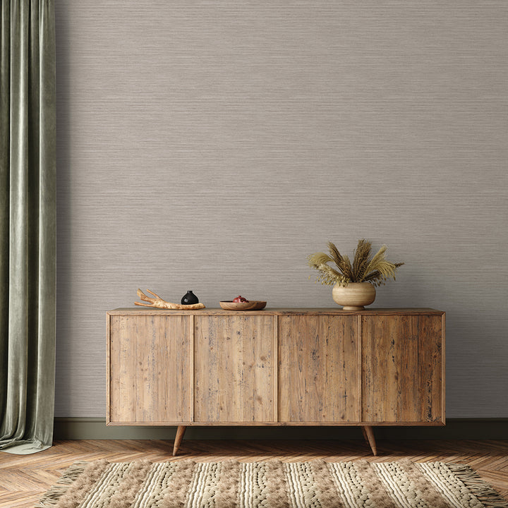 Faux Horizontal Grasscloth Removable Wallpaper - A wood sideboard and a rug in a room featuring Faux Horizontal Grasscloth Peel And Stick Wallpaper in textured pewter | Tempaper#color_textured-pewter