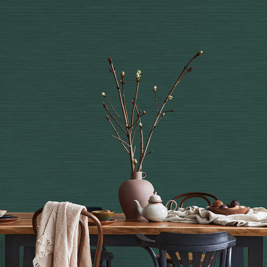 Faux Horizontal Grasscloth Removable Wallpaper - A dining room with a wood table and chairs featuring Faux Horizontal Grasscloth Peel And Stick Wallpaper in textured mediterranean teal | Tempaper#color_textured-mediterranean-teal