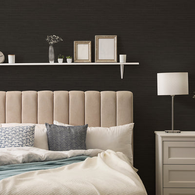 Faux Horizontal Grasscloth Removable Wallpaper - A bedroom with a bed and white nightstand featuring Faux Horizontal Grasscloth Peel And Stick Wallpaper in textured black raven | Tempaper#color_textured-black-raven