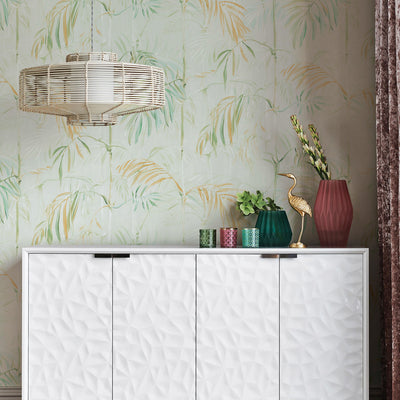 Bamboo Gardens Non-Pasted Wallpaper - A white dresser with plants and candles on top in front of Bamboo Gardens Unpasted Wallpaper in sage | Tempaper#color_sage