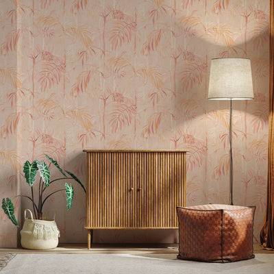 Bamboo Gardens Non-Pasted Wallpaper - A wood dresser, plant, and lamp in front of Bamboo Gardens Unpasted Wallpaper in coral | Tempaper#color_coral