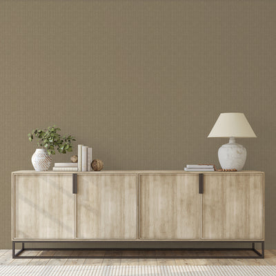 Batik Stripe Removable Wallpaper - A wood sideboard with a vase and lamp on top in front of a wall featuring Batik Stripe Peel And Stick Wallpaper in macadamia | Tempaper#color_macadamia