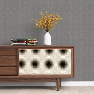 Batik Stripe Removable Wallpaper - A wood sideboard with books and a white vase on top in a room featuring Batik Stripe Peel And Stick Wallpaper in denim | Tempaper#color_denim