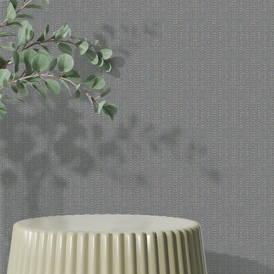 Batik Stripe Removable Wallpaper - A green table and plant in a room featuring Batik Stripe Peel And Stick Wallpaper in denim | Tempaper#color_denim