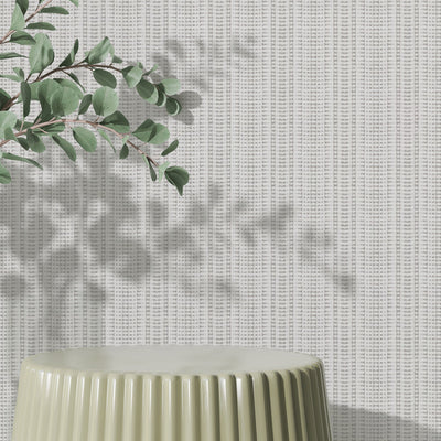 Batik Stripe Removable Wallpaper - A green table and plant in a  room featuring Batik Stripe Peel And Stick Wallpaper in french grey | Tempaper#color_french-grey