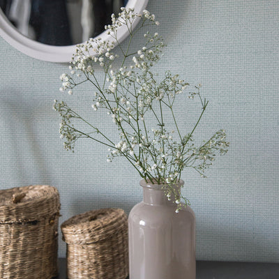 Burlap Removable Wallpaper - Two woven baskets and a grey vase with flowers in a room featuring Burlap Peel And Stick Wallpaper in ocean mist burlap | Tempaper#color_ocean-mist-burlap