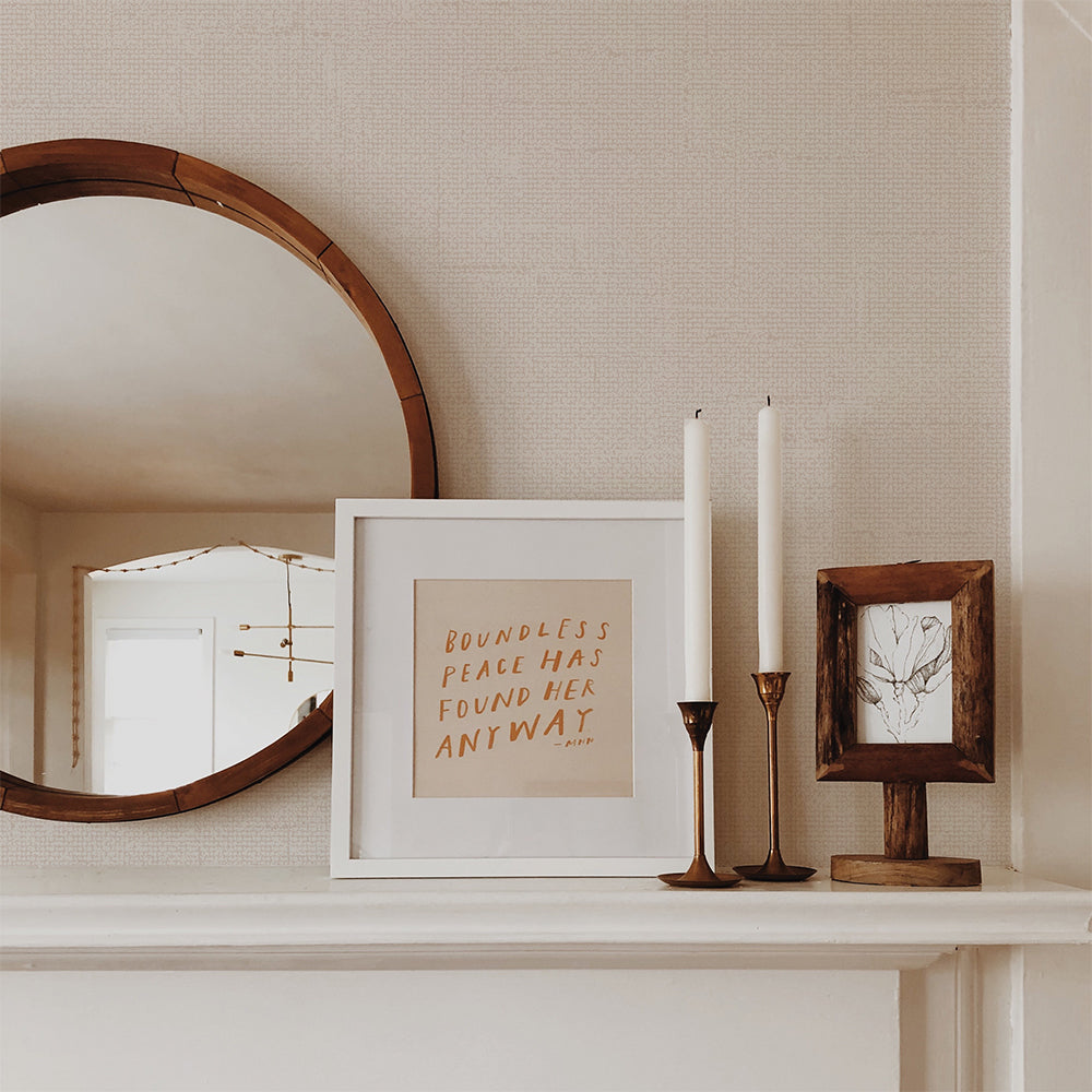Burlap Removable Wallpaper - A white shelf with candles and a picture frame on top in a room featuring Burlap Peel And Stick Wallpaper in linen burlap | Tempaper#color_linen-burlap
