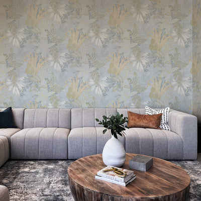 Coniferous Floral Unpasted Wallpaper - The morning dew colorway of Coniferous Floral Non-Pasted Wallpaper in a living room behind a grey couch | Tempaper#color_morning-dew