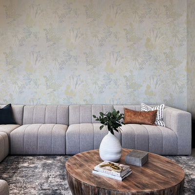 Coniferous Floral Unpasted Wallpaper - The silk colorway of Coniferous Floral Non-Pasted Wallpaper in a living room behind a grey couch | Tempaper#color_silk