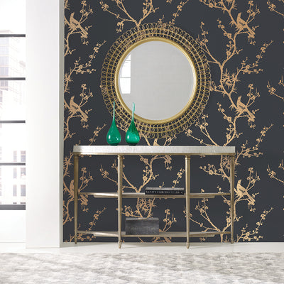 Bird Watching Removable Wallpaper By Cynthia Rowley - A wall with a gold mirror in a room featuring Tempaper's Bird Watching Peel And Stick Wallpaper By Cynthia Rowley in black and gold birds#color_black-and-gold-birds