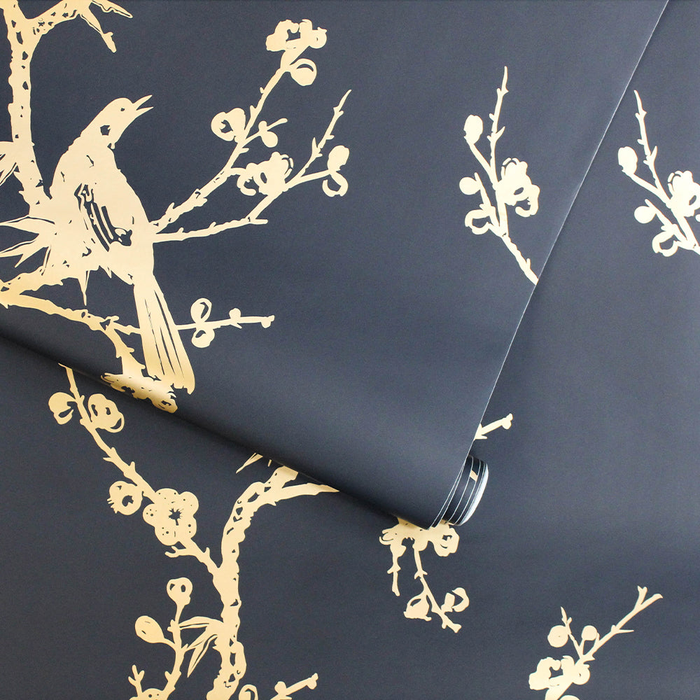 Bird Watching Removable Wallpaper By Cynthia Rowley - A roll of Tempaper's Bird Watching Peel And Stick Wallpaper By Cynthia Rowley in black and gold birds#color_black-and-gold-birds