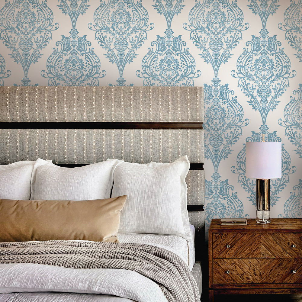 Estate Damask Non-Pasted Wallpaper - A bedroom and nightstand in front of Estate Damask Unpasted Wallpaper in coastal blue damask | Tempaper#color_coastal-blue-damask