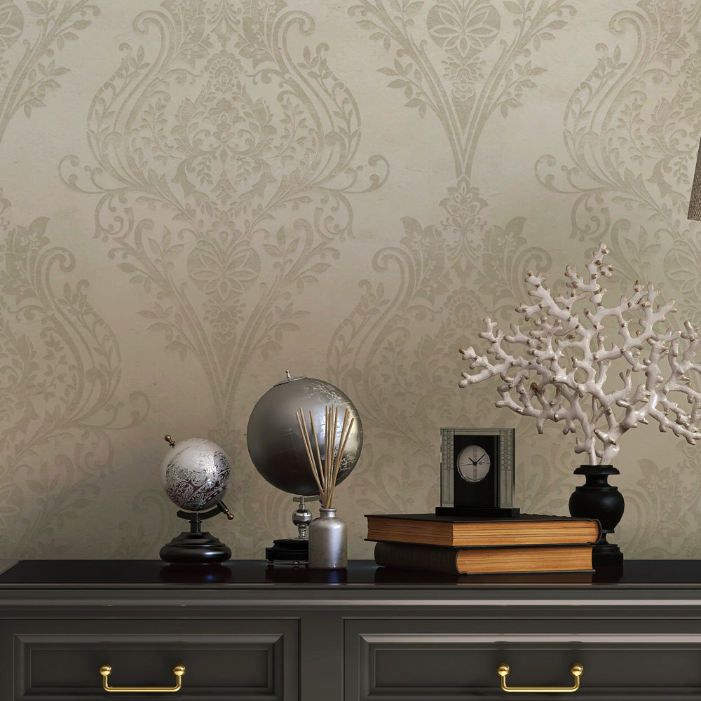 Estate Damask Non-Pasted Wallpaper - A black dresser with books in front of Estate Damask Unpasted Wallpaper in champagne damask | Tempaper#color_champagne-damask