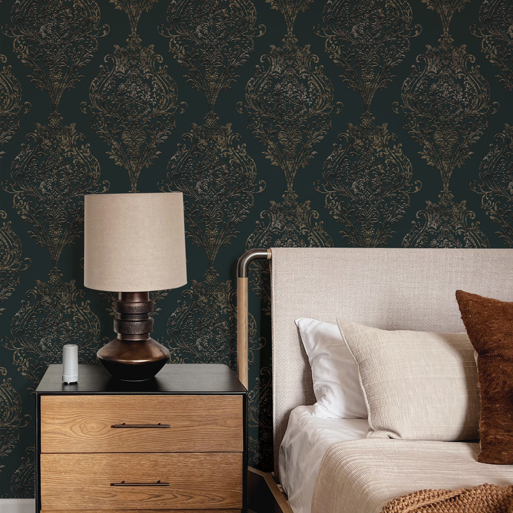 Estate Damask Non-Pasted Wallpaper - A bedroom and nightstand in front of Estate Damask Unpasted Wallpaper in charcoal damask | Tempaper#color_charcoal-damask