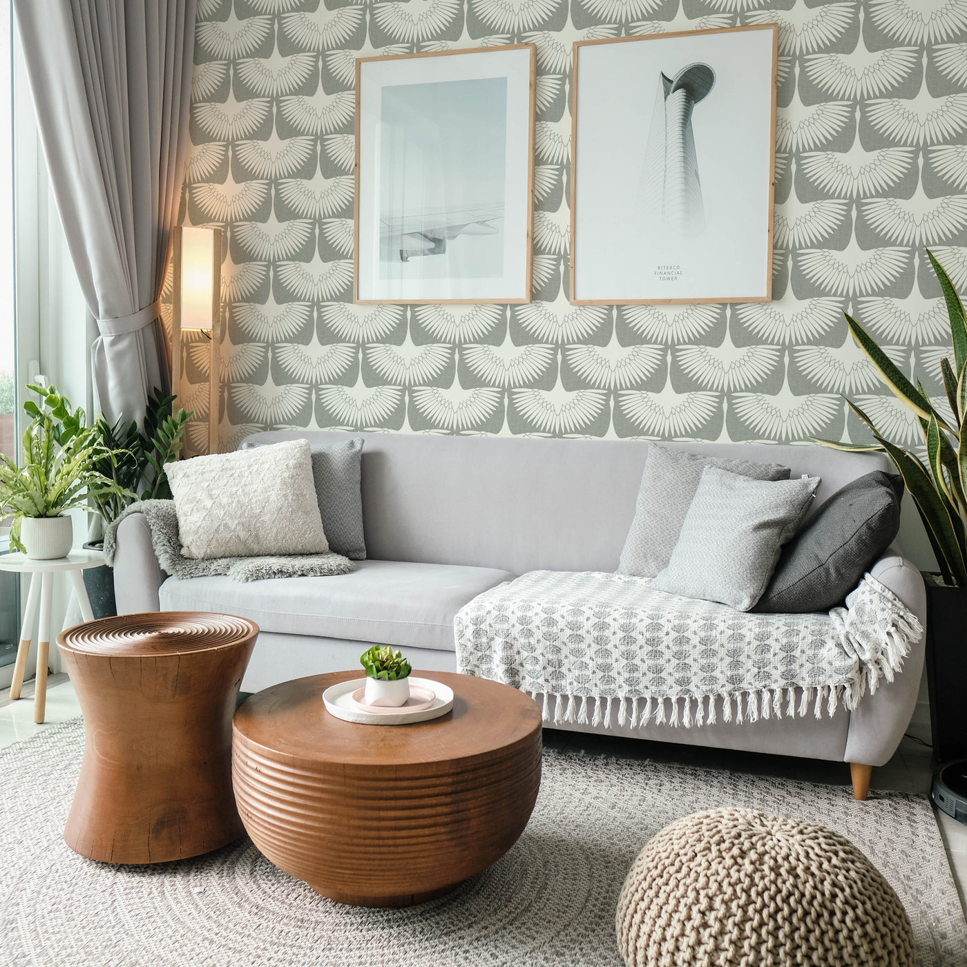 Feather Flock Removable Wallpaper - A grey couch, brown coffee tables, and plants in a room featuring Tempaper's Feather Flock Peel And Stick Wallpaper in chalk scallops#color_chalk-scallops