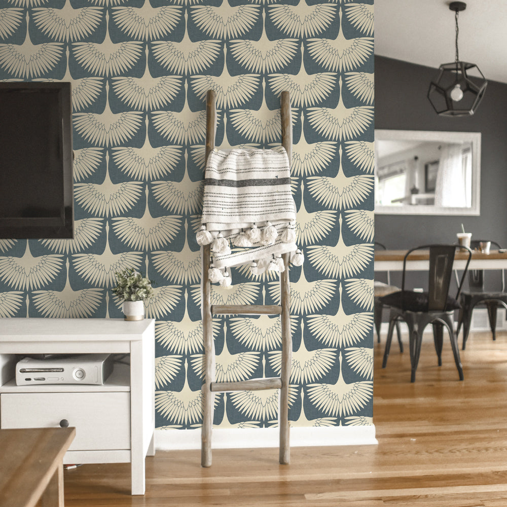 Feather Flock Removable Wallpaper - A TV, white entertainment center, and wood ladder in front of a wall featuring Tempaper's Feather Flock Peel And Stick Wallpaper in denim blue scallops#color_denim-blue-scallops