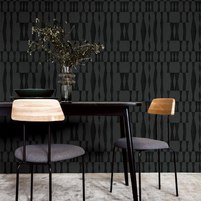 Faux Grasscloth Geo Removable Wallpaper - Two chairs and a black table in a room featuring Faux Grasscloth Geo Peel And Stick Wallpaper in textured carbon | Tempaper#color_textured-carbon