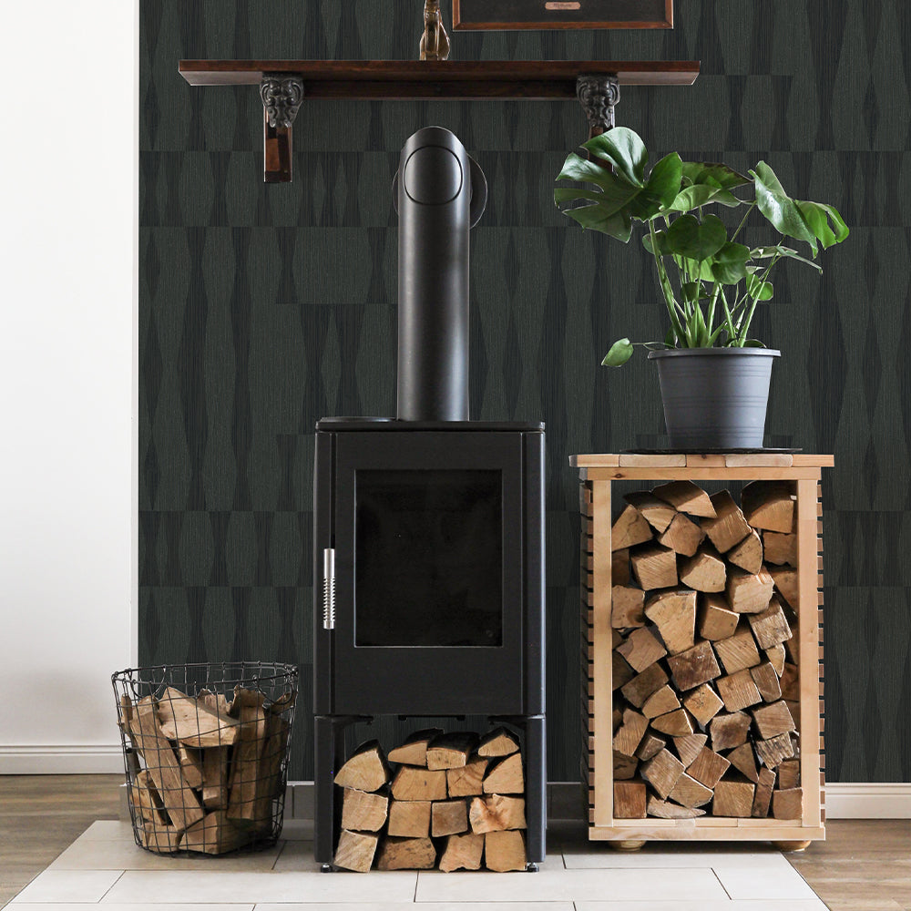 Faux Grasscloth Geo Removable Wallpaper - A black fireplace with firewood in a room featuring Faux Grasscloth Peel And Stick Wallpaper in textured seagrass | Tempaper#color_textured-seagrass