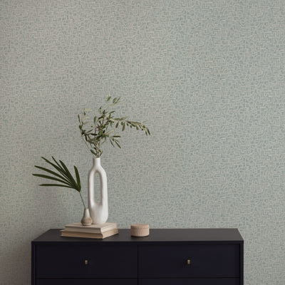 Glyph Geo Non-Pasted Wallpaper - A black dresser with plants in white vases in front of Glyph Geo Unpasted Wallpaper in mint geo | Tempaper#color_mint-geo