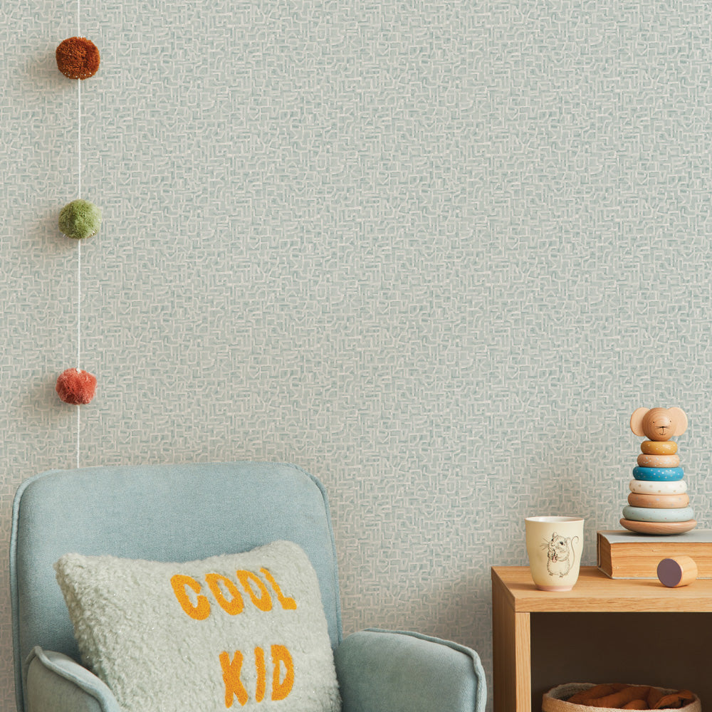 Glyph Geo Non-Pasted Wallpaper - A kids bedroom with a blue chair and wood dresser featuring Glyph Geo Unpasted Wallpaper in mint geo | Tempaper#color_mint-geo