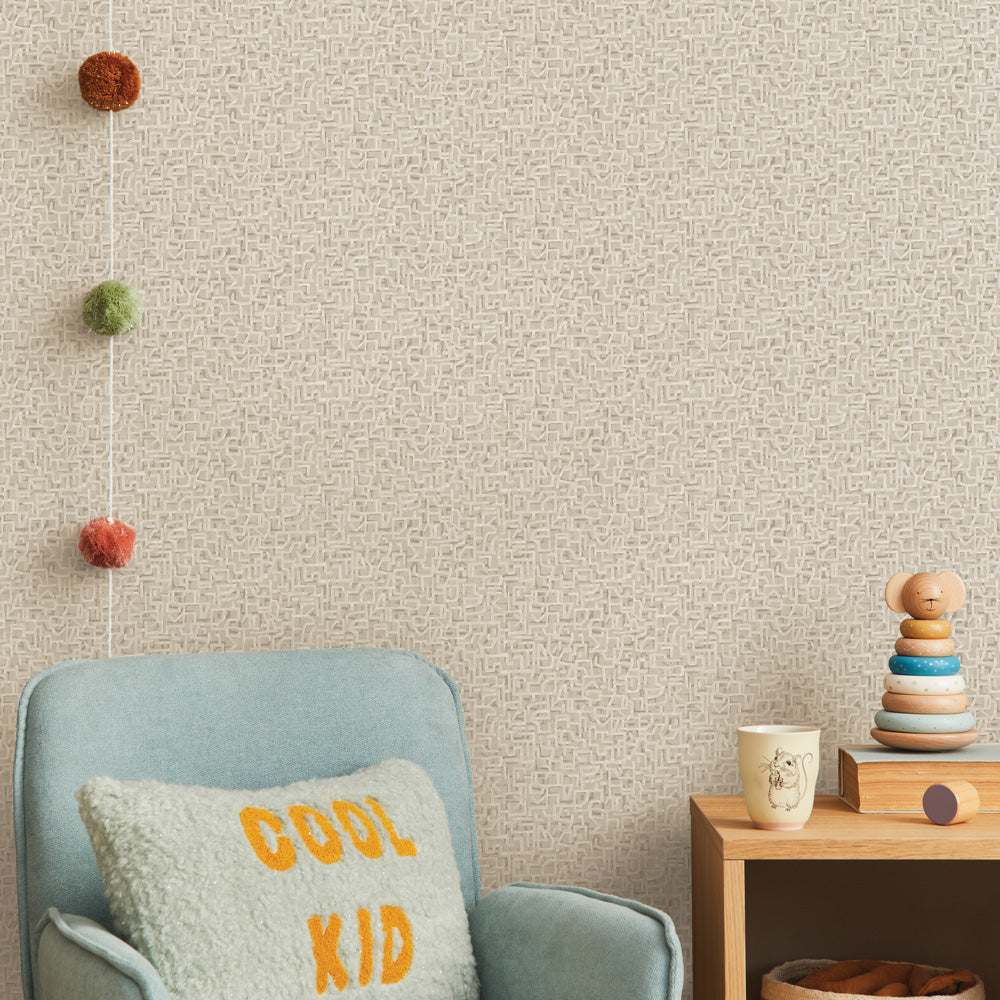 Glyph Geo Non-Pasted Wallpaper - A kids bedroom with a blue chair and wood dresser featuring Glyph Geo Unpasted Wallpaper in fawn geo | Tempaper#color_fawn-geo