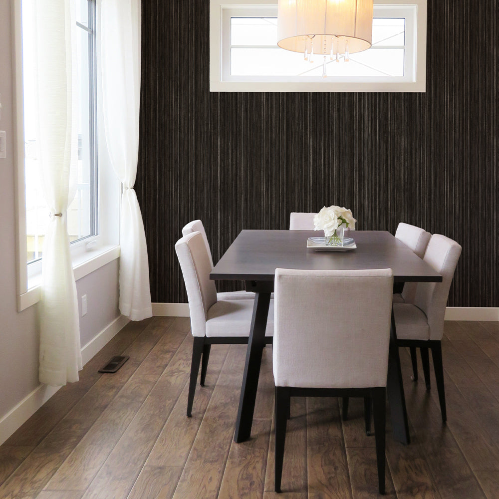 Faux Grasscloth Removable Wallpaper - A brown table and white chairs in a dining room featuring Faux Grasscloth Peel And Stick Wallpaper in textured black linen | Tempaper#color_textured-black-linen