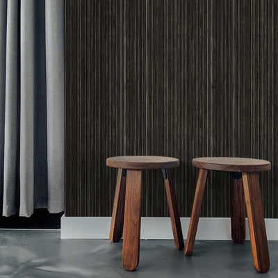 Faux Grasscloth Removable Wallpaper - Two wood stools in a room featuring Faux Grasscloth Peel And Stick Wallpaper in textured black linen | Tempaper#color_textured-black-linen